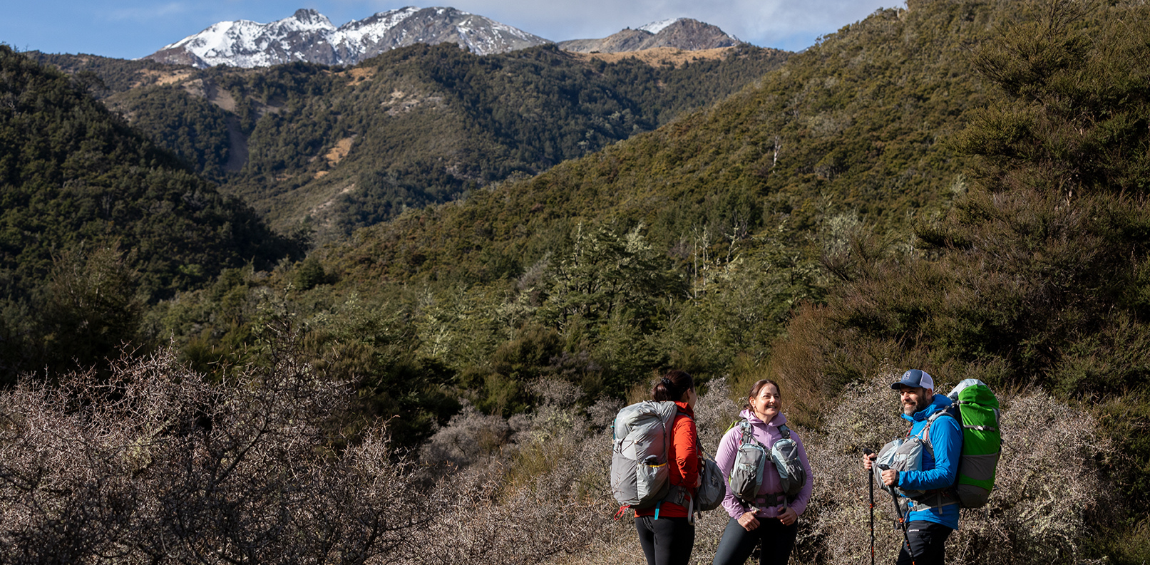 Three people wearing comfortable hiking backpacks Aarn Packs in the New Zealand wilderness